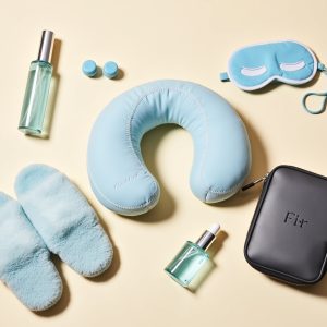 Flux_Dev_A_serene_travel_essentials_arrangement_on_a_soft_crea_1 Deluxe Flight Comfort Kit